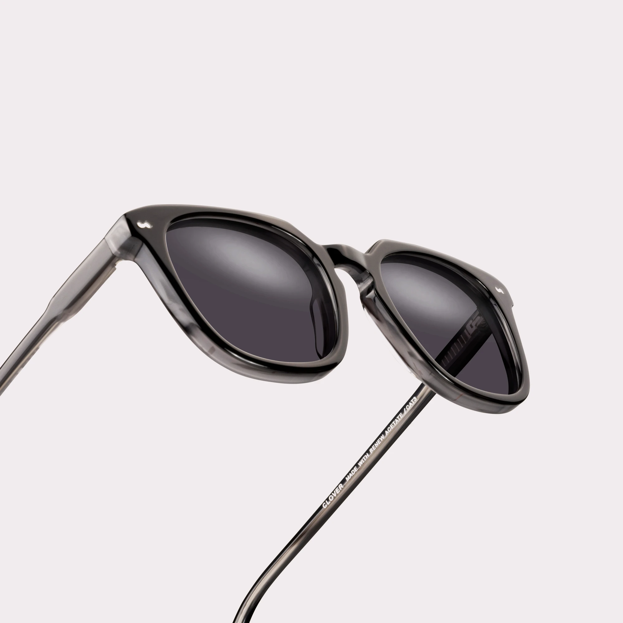 A pair of Clover Black Sunglasses in a macro view