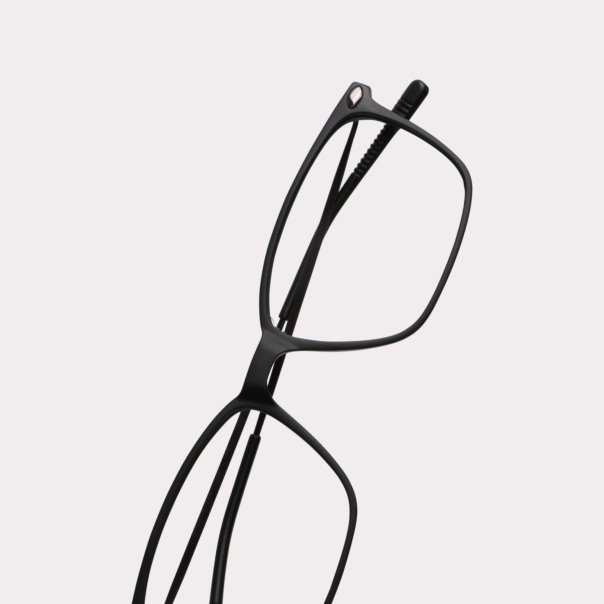 A pair of Bao Black Reading glasses in a macro view