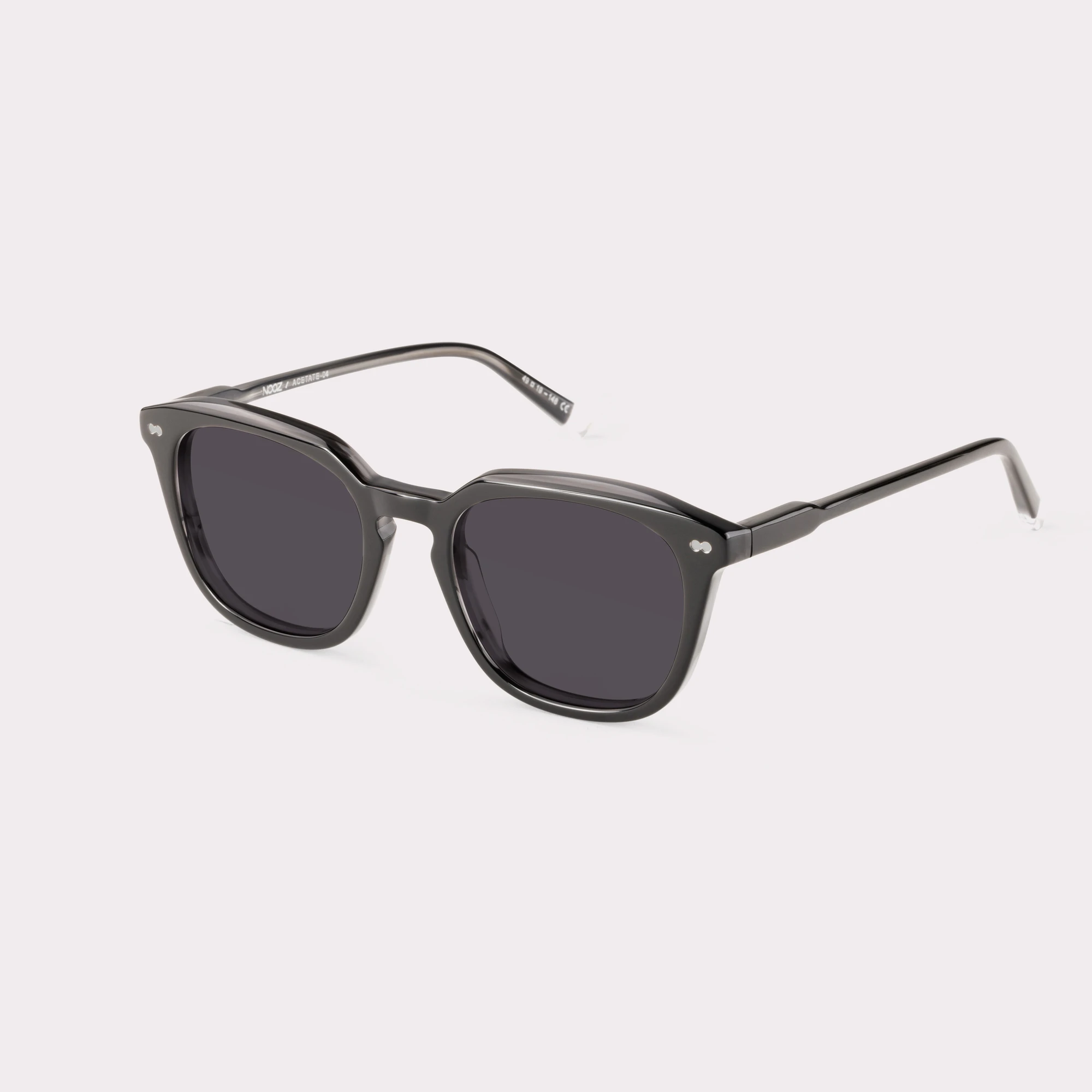 A pair of Clover Black Sunglasses  seen from the side
