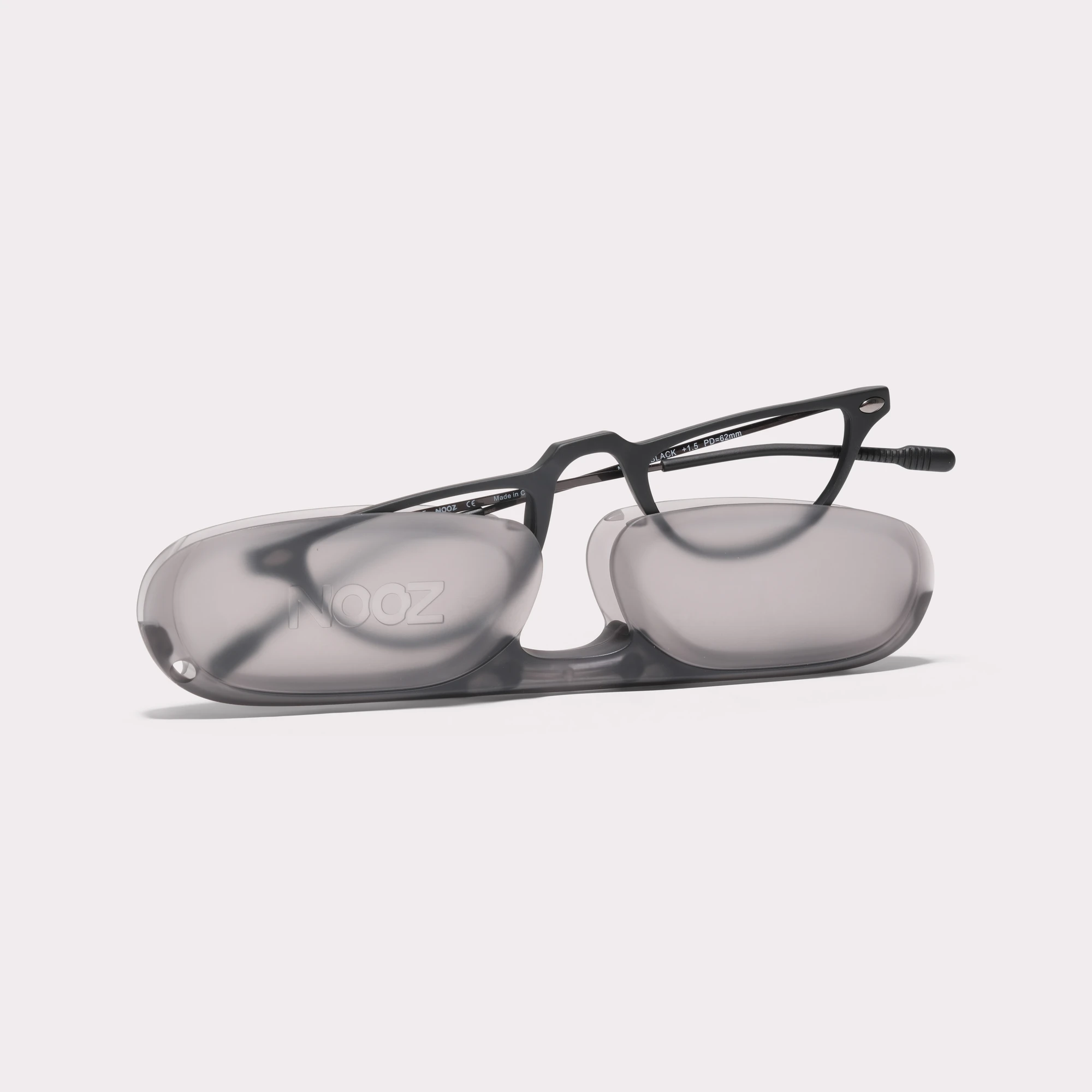 A pair of Moon Black Reading glasses coming out of its case