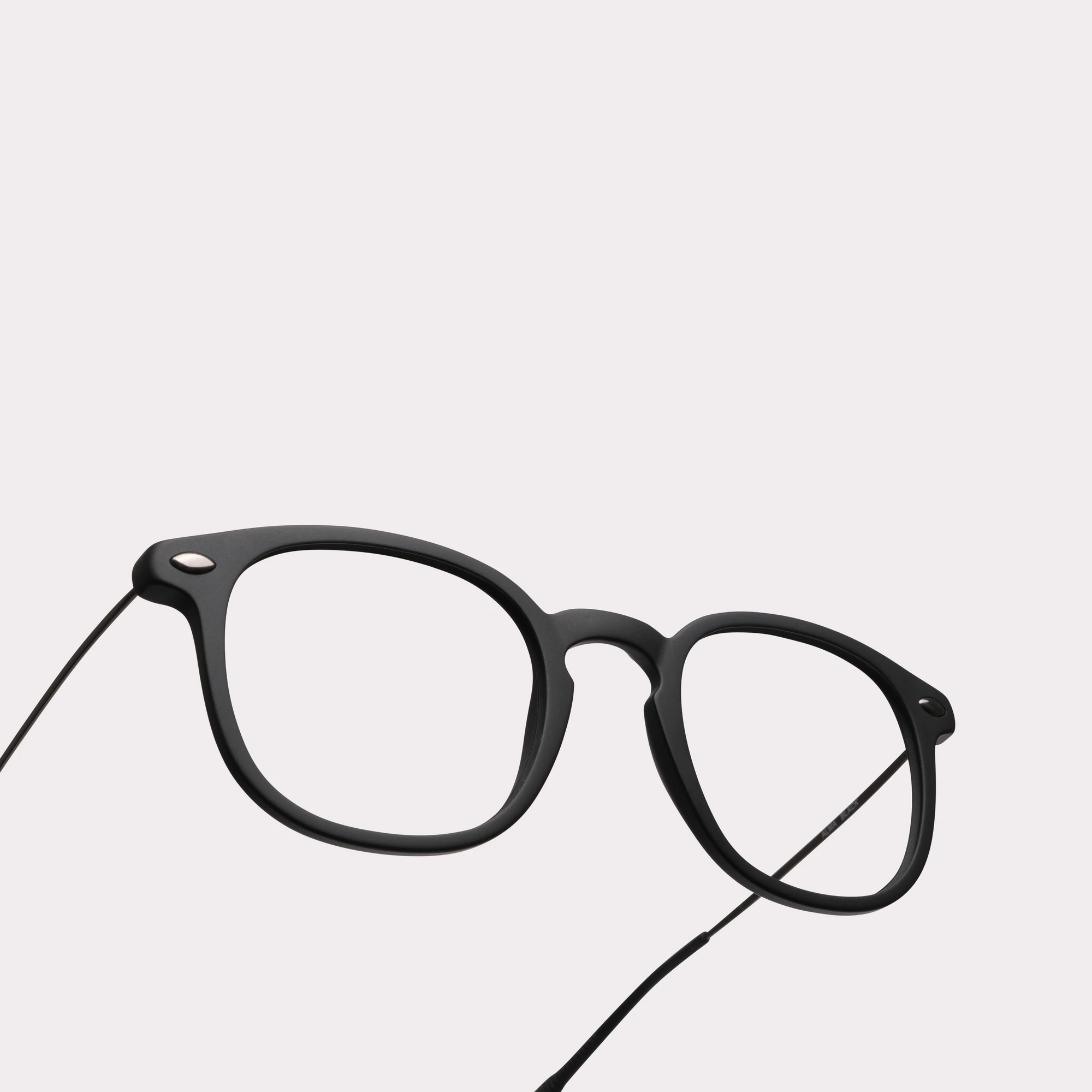 A pair of Alma Black Reading glasses in a macro view
