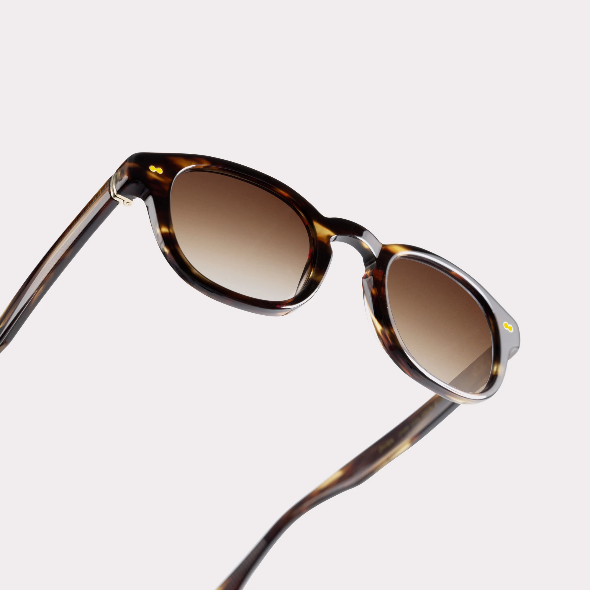 A pair of Owen Havana Sunglasses in a macro view